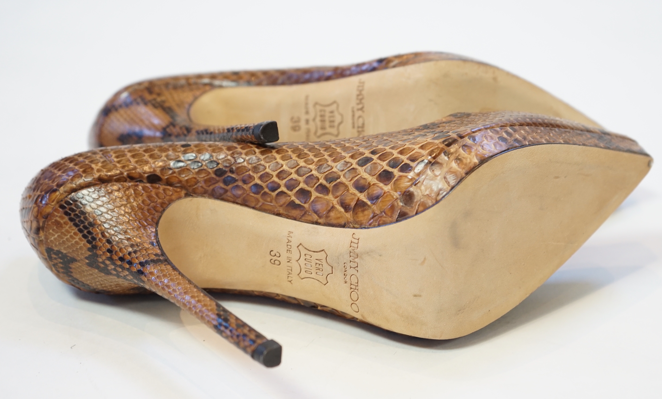 A pair of Jimmy Choo lady's snakeskin platform pumps in brown and black